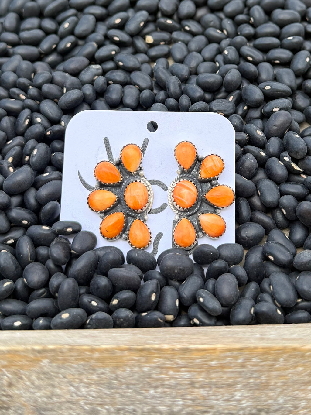 Spiny orange half cluster earrings