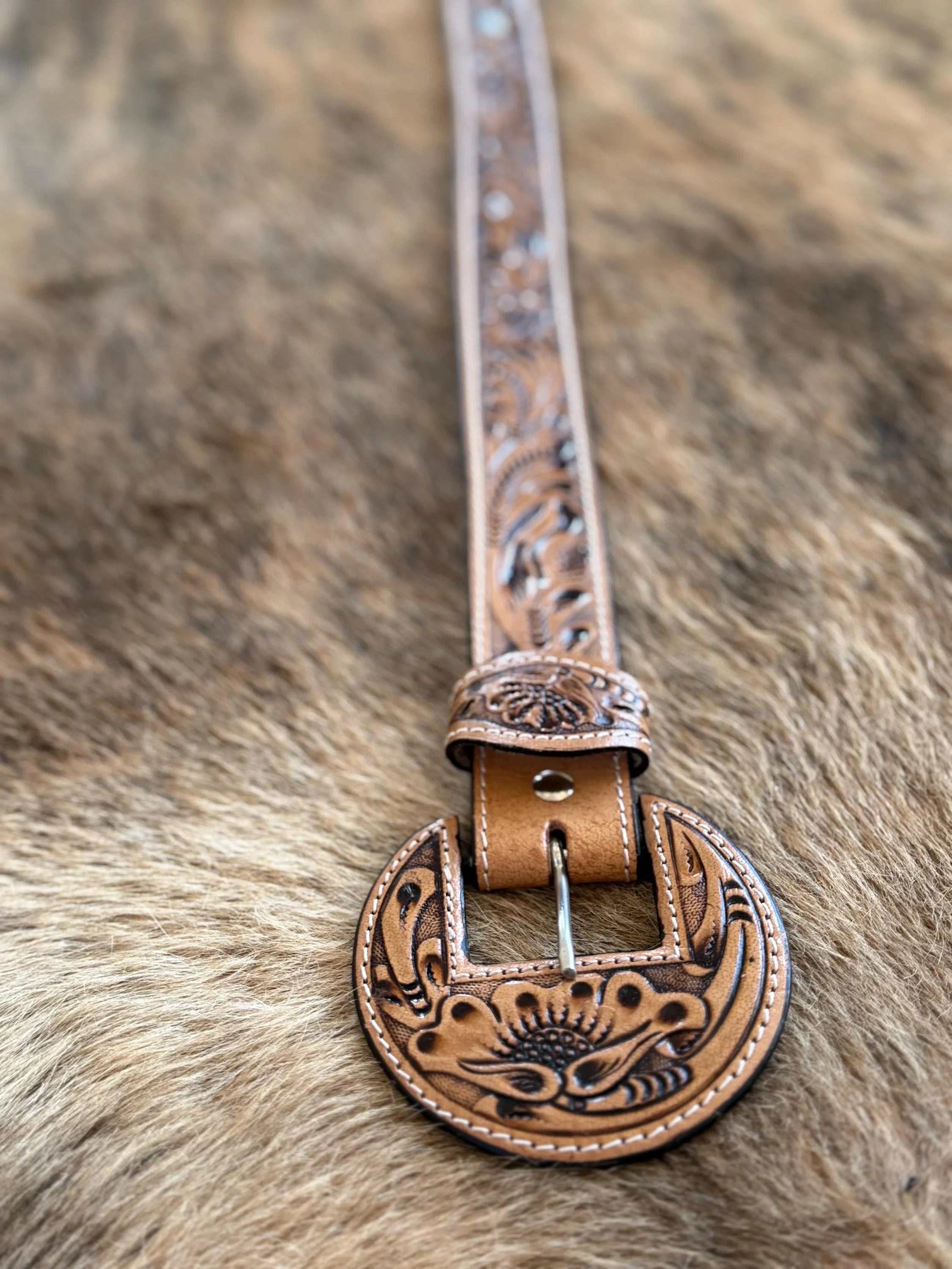 Round buckle tooled leather belt