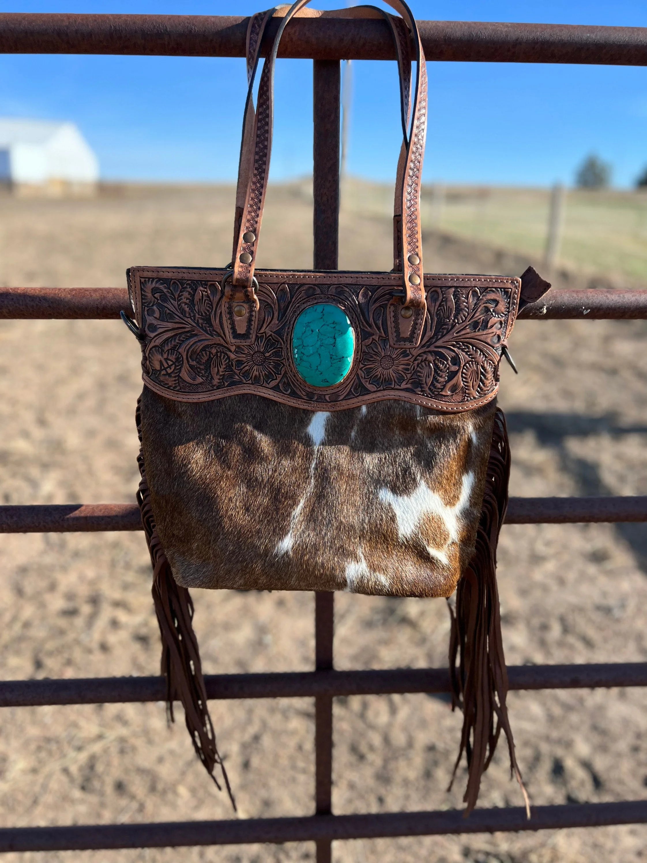 Stunning cowhide fringe purse