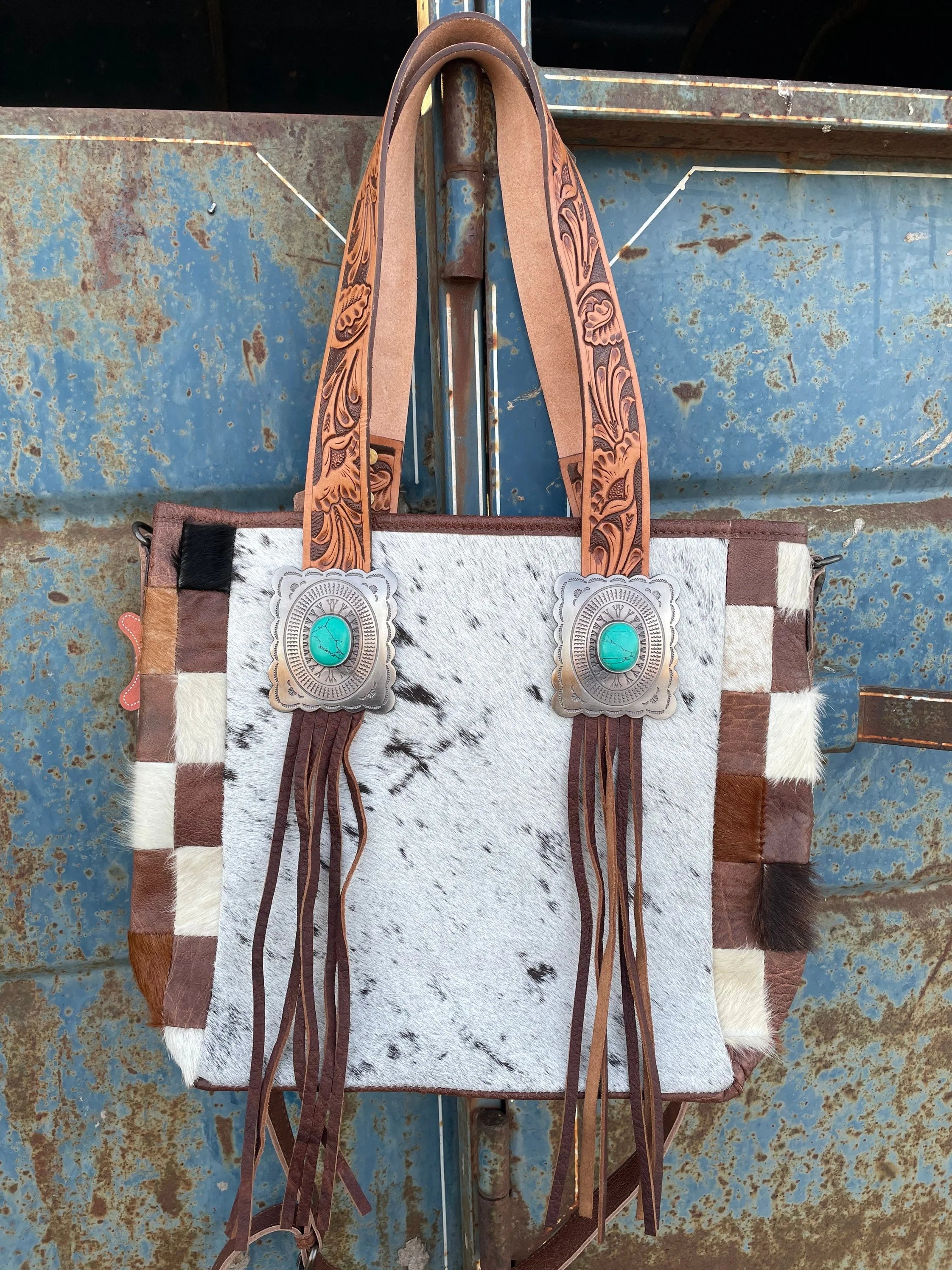 Cowhide concho purse
